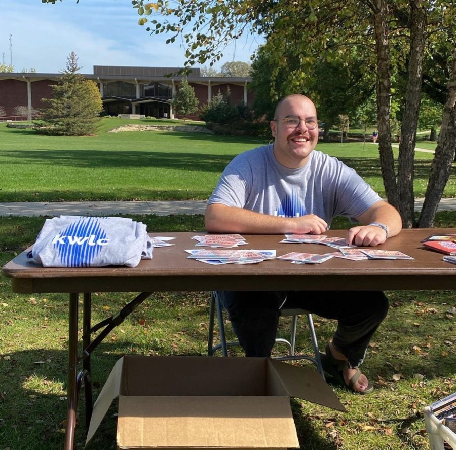 Asher Smith (‘22) tabling KWLC merch last spring. Photo courtesy of KWLC’s instagram page (@kwlc1240).