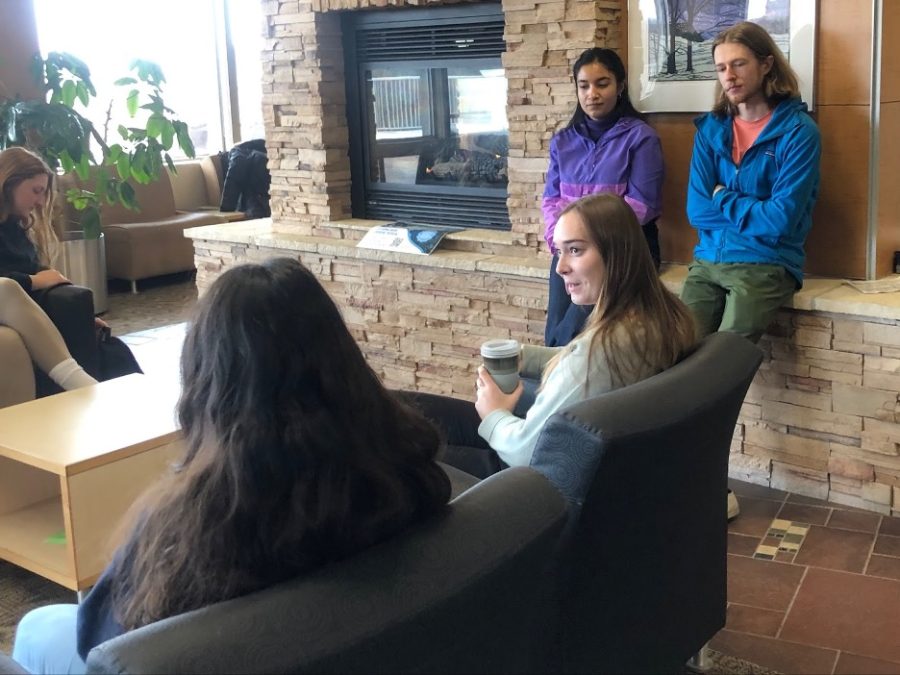 Students gathered by the fireplace in the Union to discuss traveling abroad on Luther away programs. Photo courtesy of Verena Mueller-Baltes (‘26)