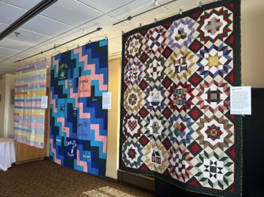 Quilts displayed at the Quilting and Singing in Community event held in the Peace Dining Room on April 2. Local quilters and the Aurora Choir came together to shine a spotlight on the Luther College Suture Exhibition. Photo courtesy of Andrea Triminio (‘26). 
