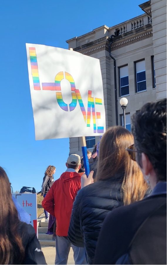 Photo of rally sign within the crowd on the courthouse steps. Courtesy of Lydia Marti (‘26)