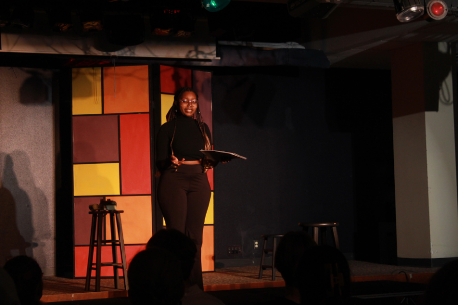 Intersectional Feminist Club President Tala Nengola (‘23) performs as a part of the Everything In Between Monologues in Marty’s on May 2. Photo by Verena Mueller-Baltes (‘26). 