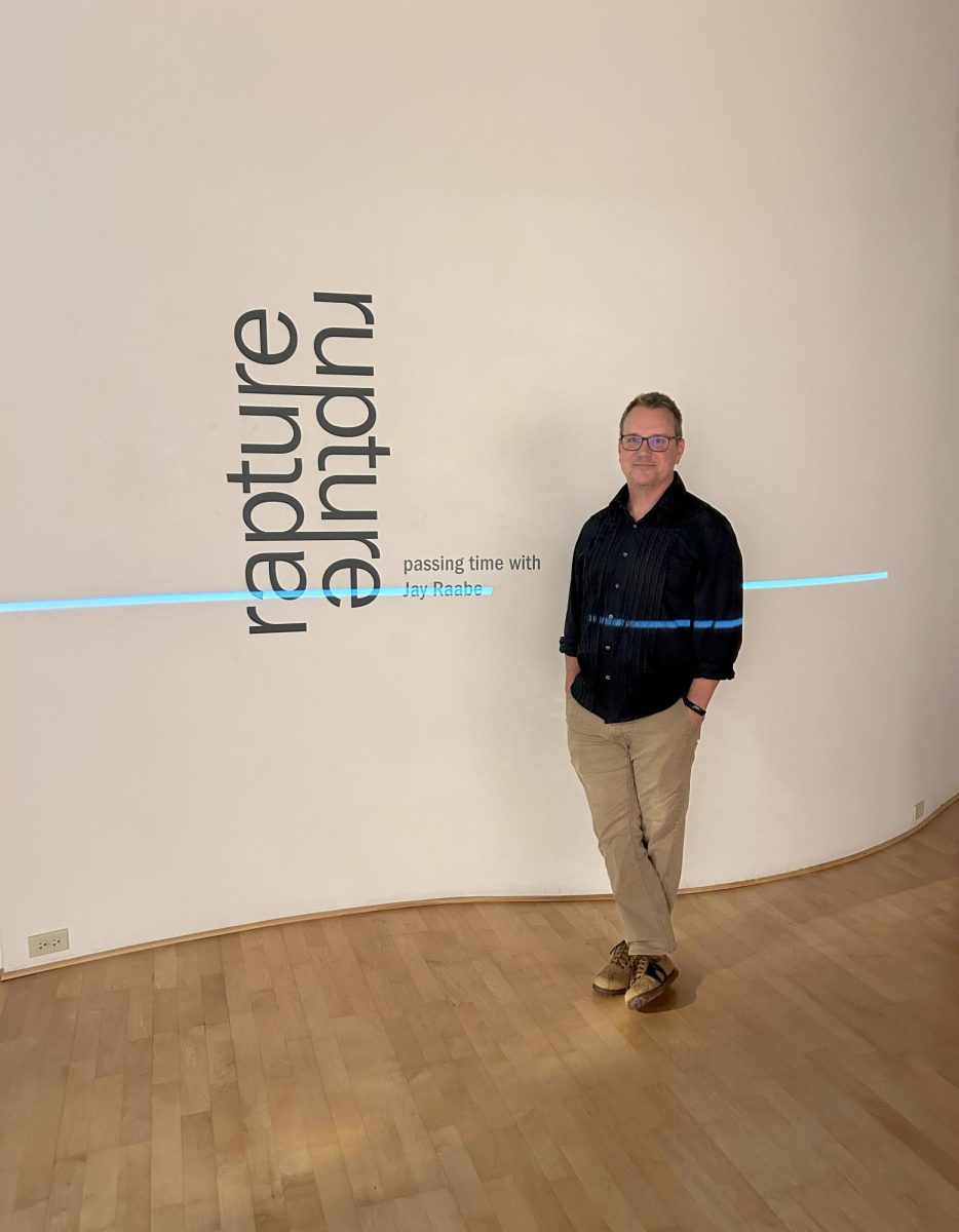 Artist Jay Raabe poses for a photo in his exhibit, “rapture/rupture”, in the Kristen Wigley-Fleming Gallery.