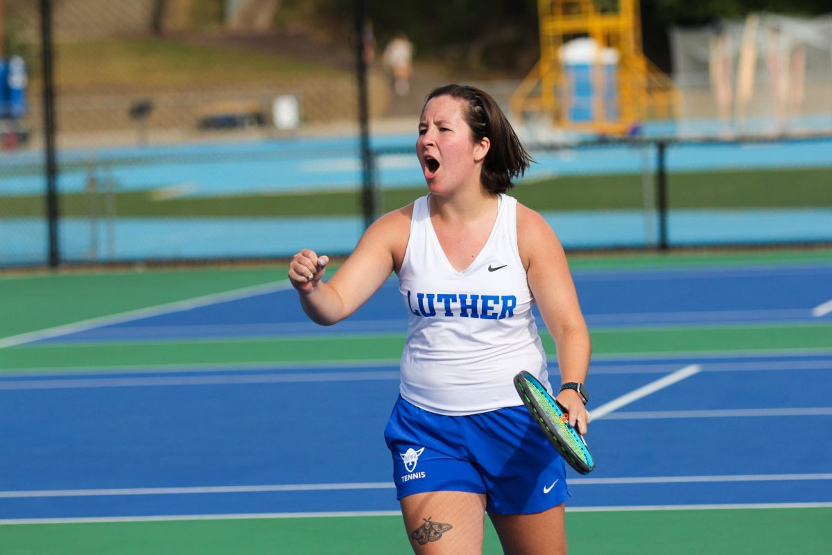 Jay Mascardo (27) celebrates winning a doubles point against Coe College on September 19. Photo courtesy of Luther College Photo Bureau