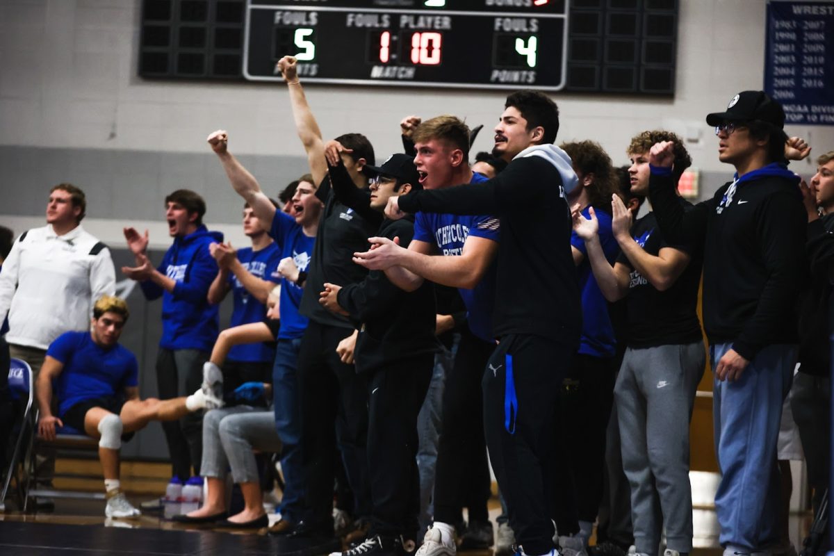 The Luther Wrestling team gets loud in the Regents gym during a dual meet against Wartburg on December 2, 2022. Photo courtesy of Luther College Photo Bureau.