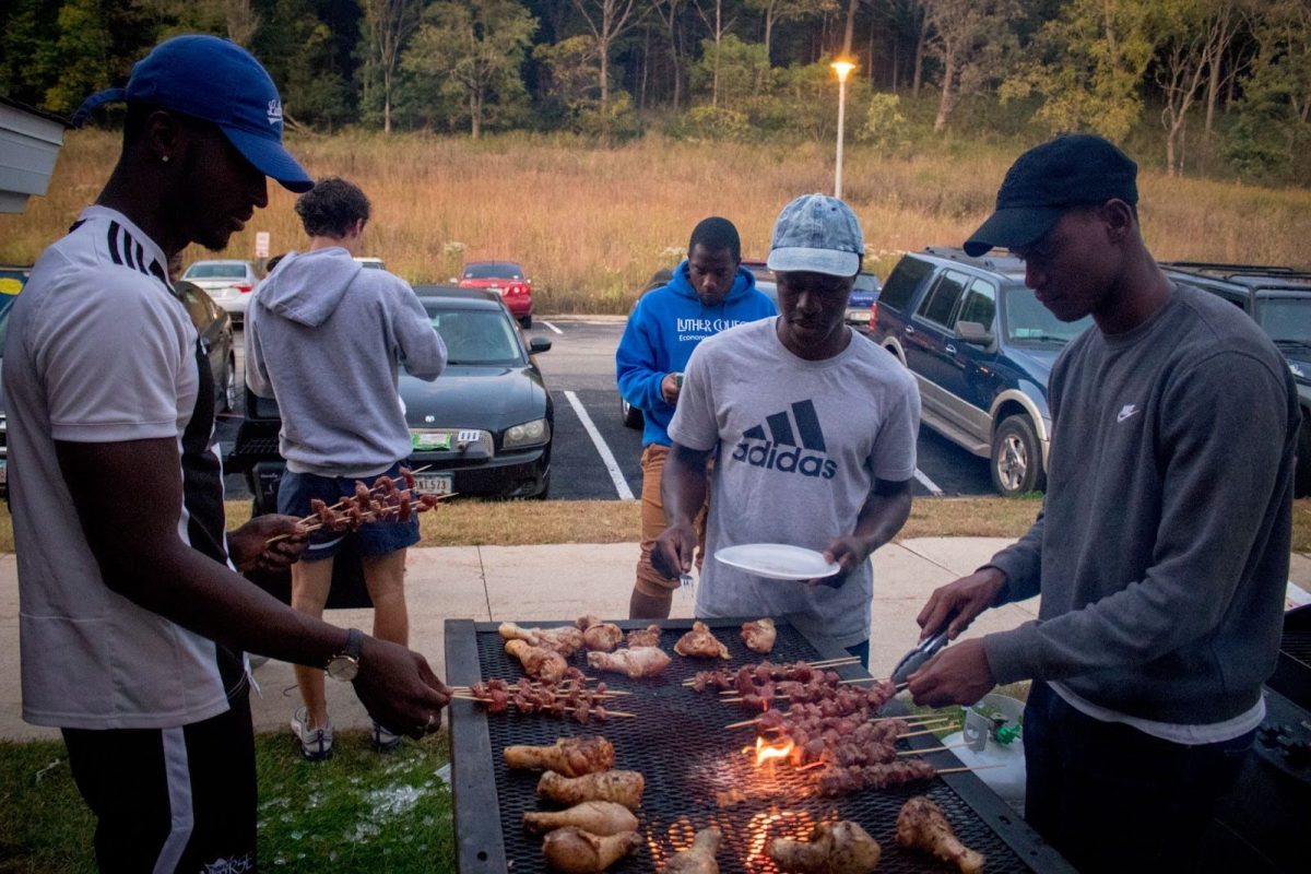 A+group+of+international+students+share+a+cookout+at+Baker+Commons+during+break.+Photo+courtesy+of+Luther+Photo+Bureau.