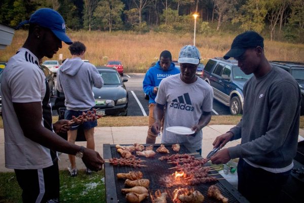 A group of international students share a cookout at Baker Commons during break. Photo courtesy of Luther Photo Bureau.