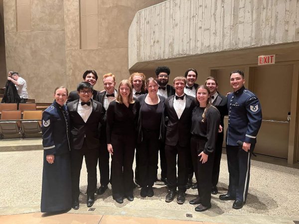 Luther student musicians and Director of Bands Cory Near pose for a photo with members of the United States Air Force Band. Photo courtesy of Sam Maston.