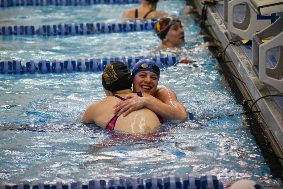 Mia Prater (27) swam a record-breaking time in the womens 50 freestyle at the A-R-C Championships, which qualified her for the NCAA DIII Swimming and Diving Championships on March 20-23. Photo courtesy of Luther College Photo Bureau.