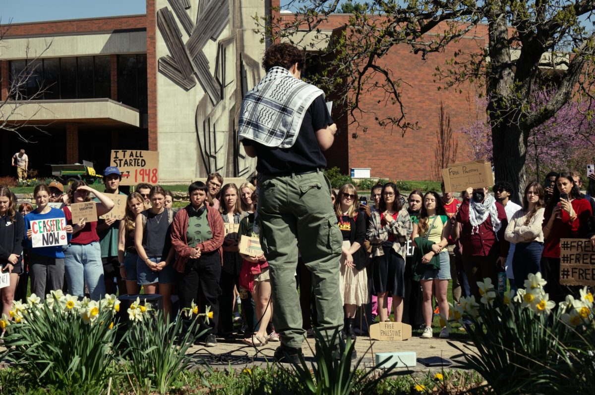 Students gathered in Bentdahl Commons listen to the organizer of the March for Palestine on April 30.