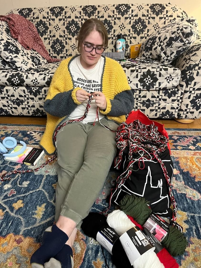 Tallulah Campbell (‘24) makes a graduation cord in the colors of the Palestinian flag. Photo courtesy of Tallulah Campbell.