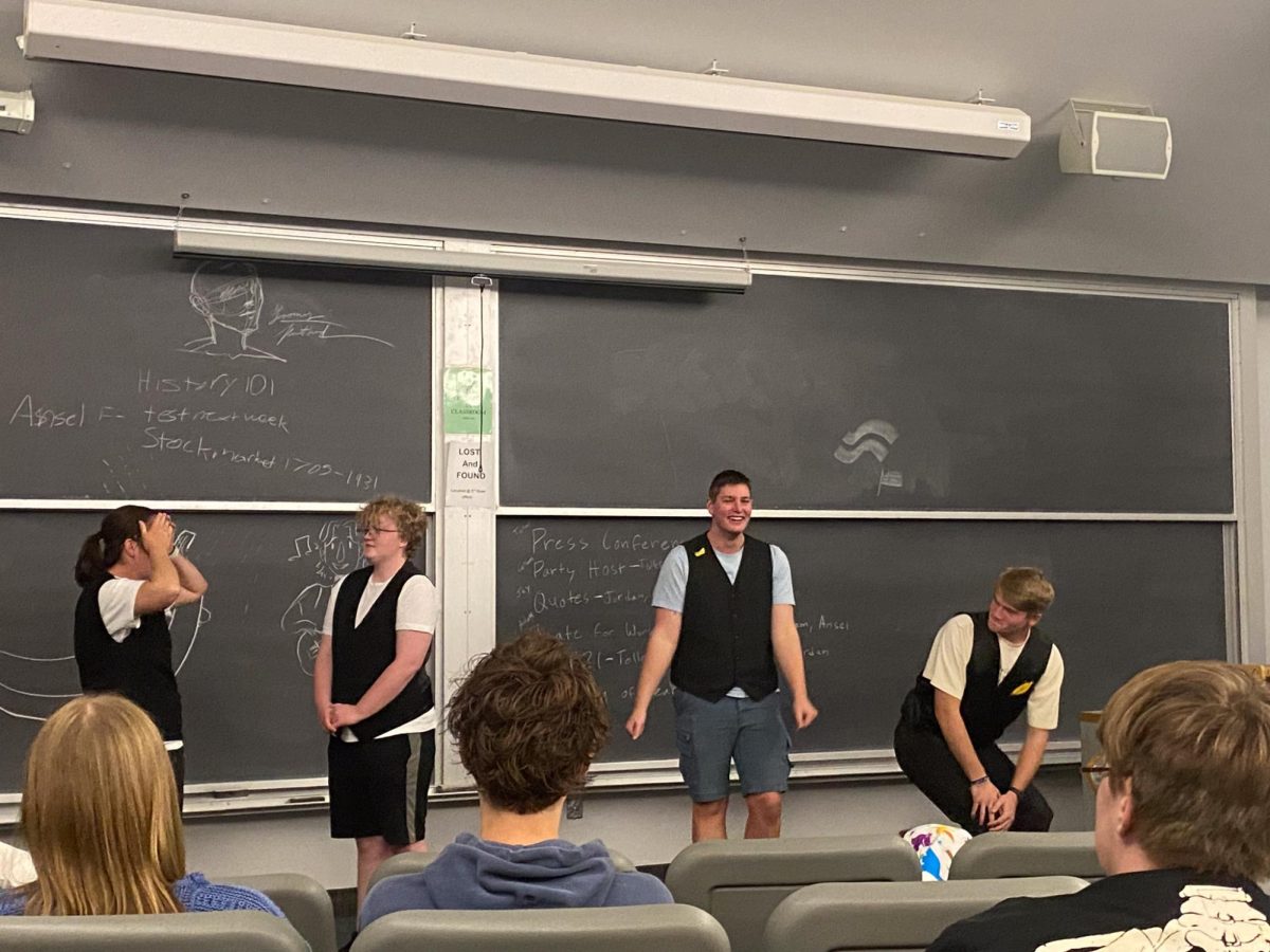 Members of Top Banana play the improv game “Party Host” during the October show.