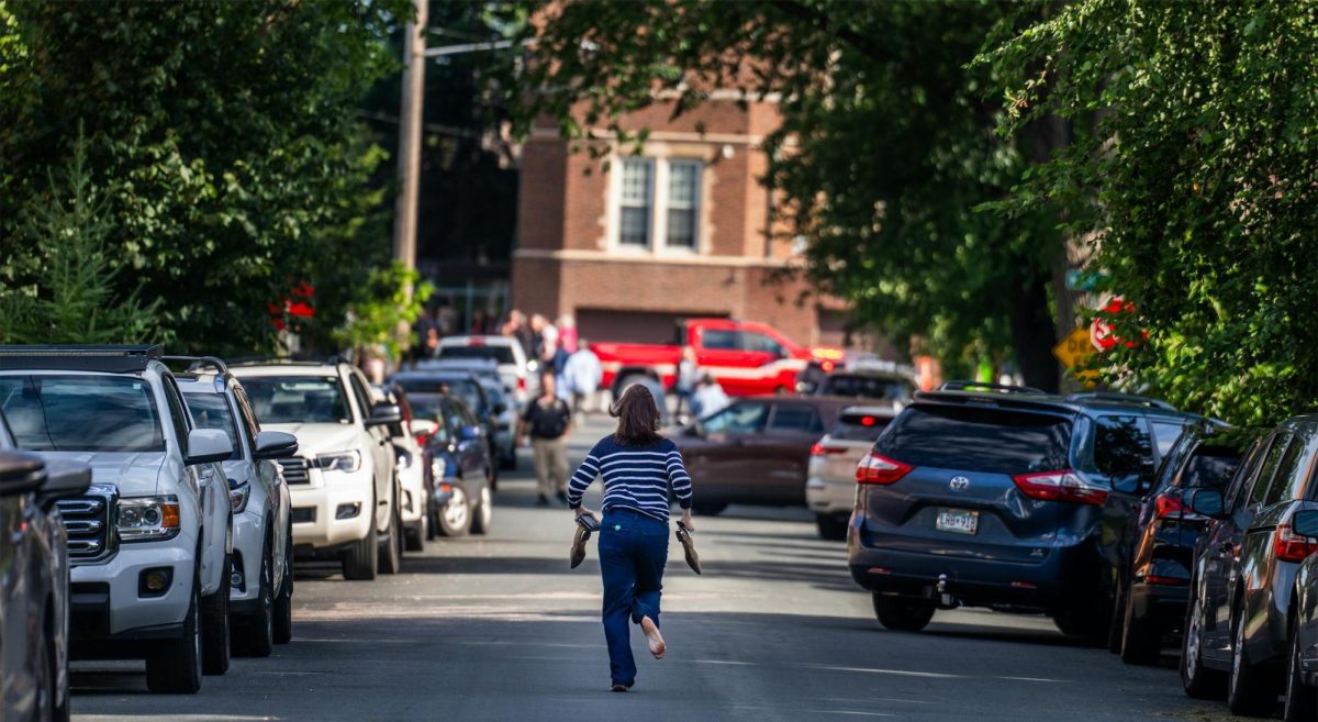 A barefoot parent runs towards the active shooter situation at Annunciation Church and School on Aug. 27, 2025. Photo courtesy of Richard Tsong-Taatarii/Minnesota Star Tribune. 